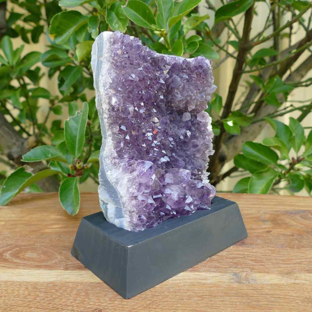 amethyst cluster on wood base