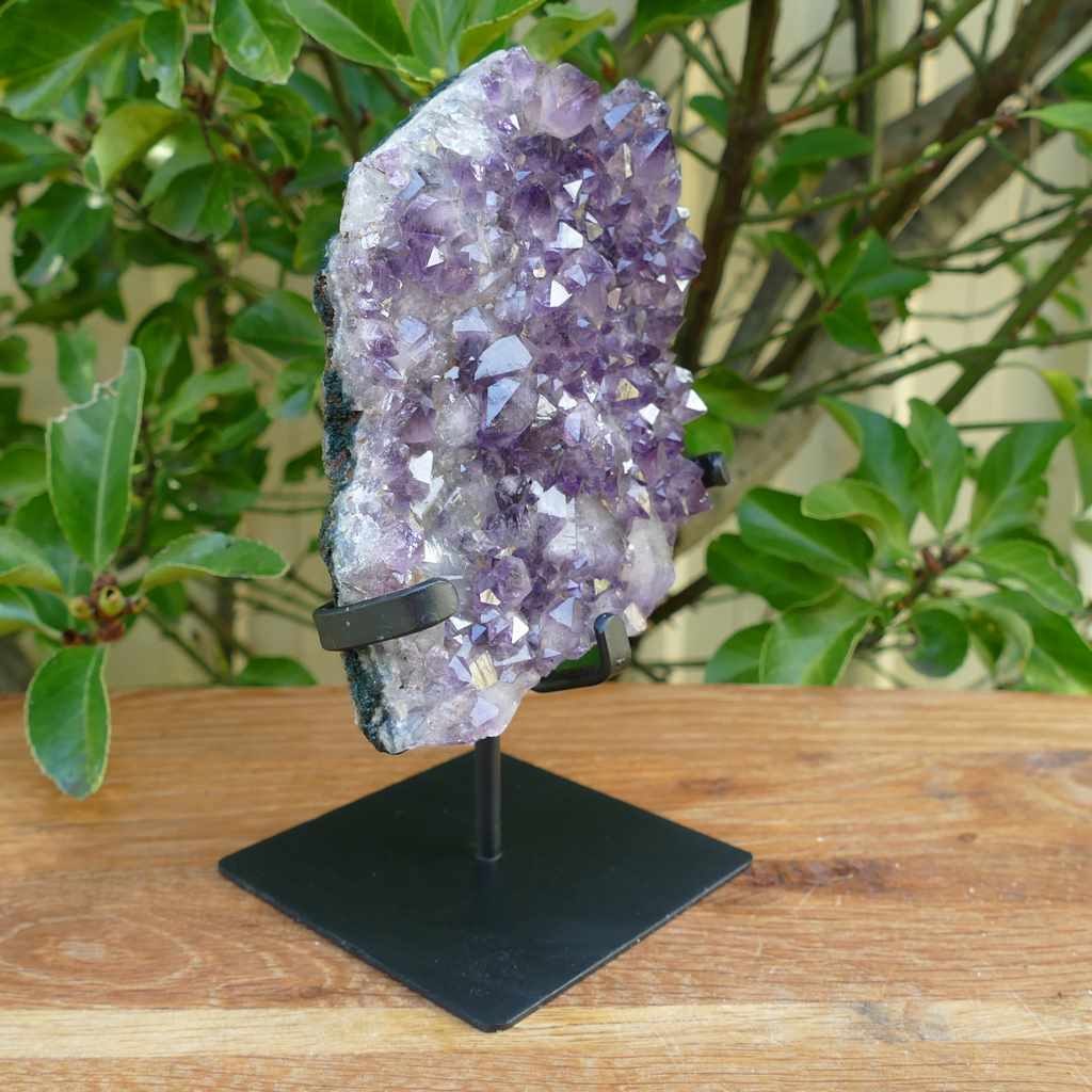 amethyst cluster on metal stand