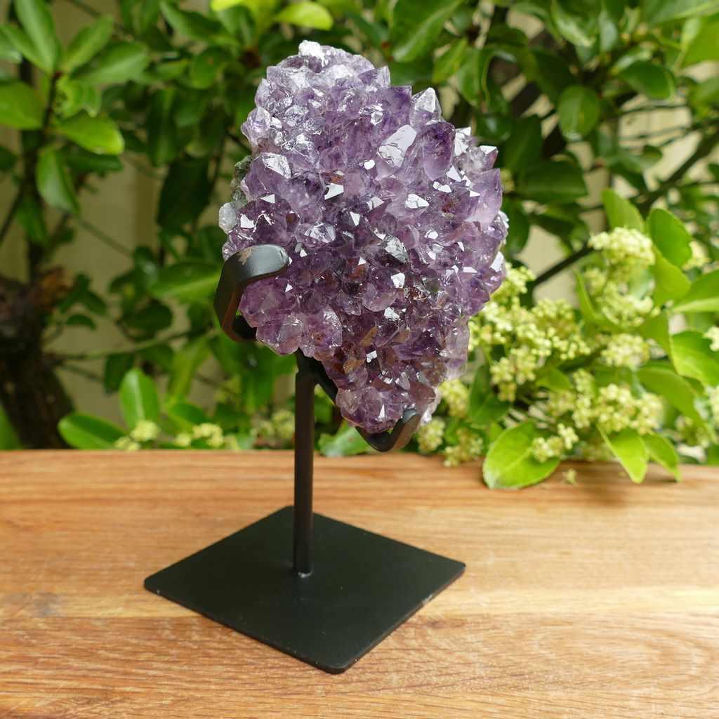 amethyst cluster on metal stand