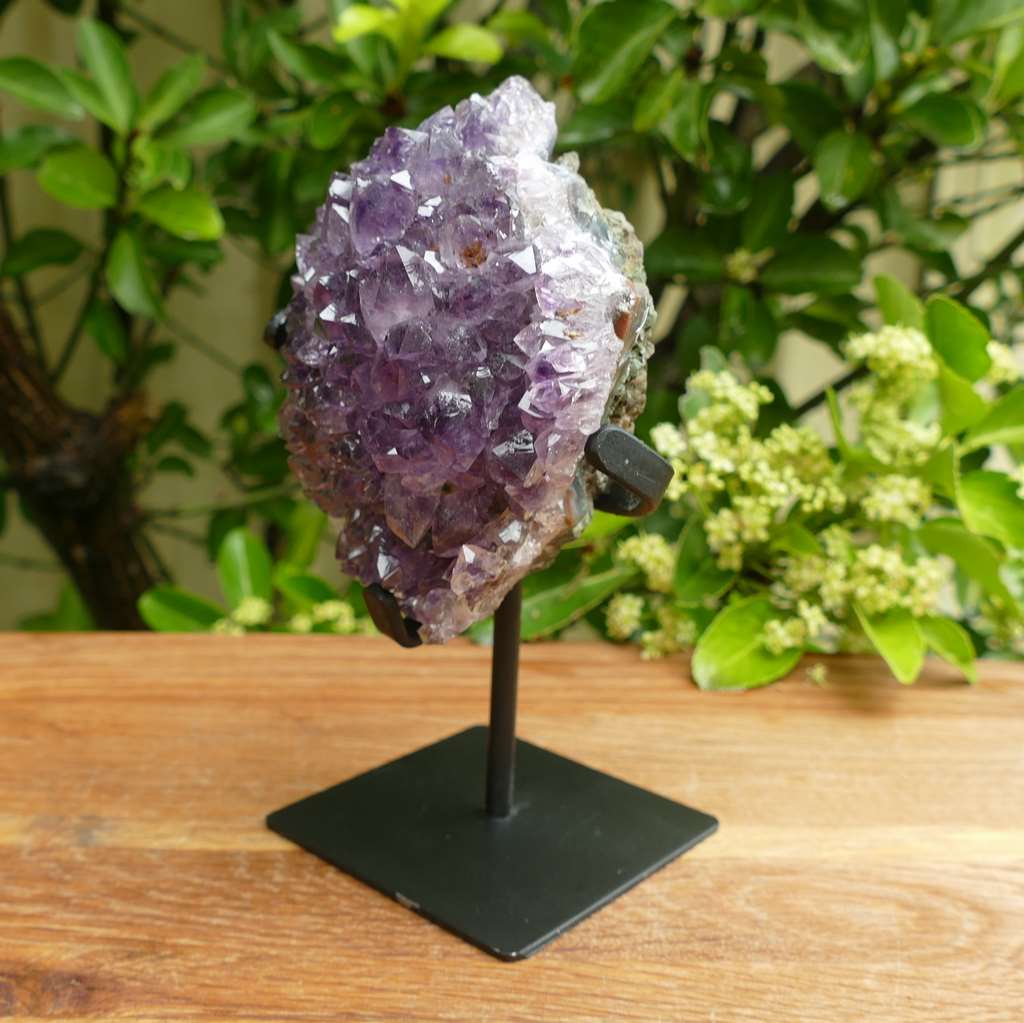 amethyst cluster on metal stand