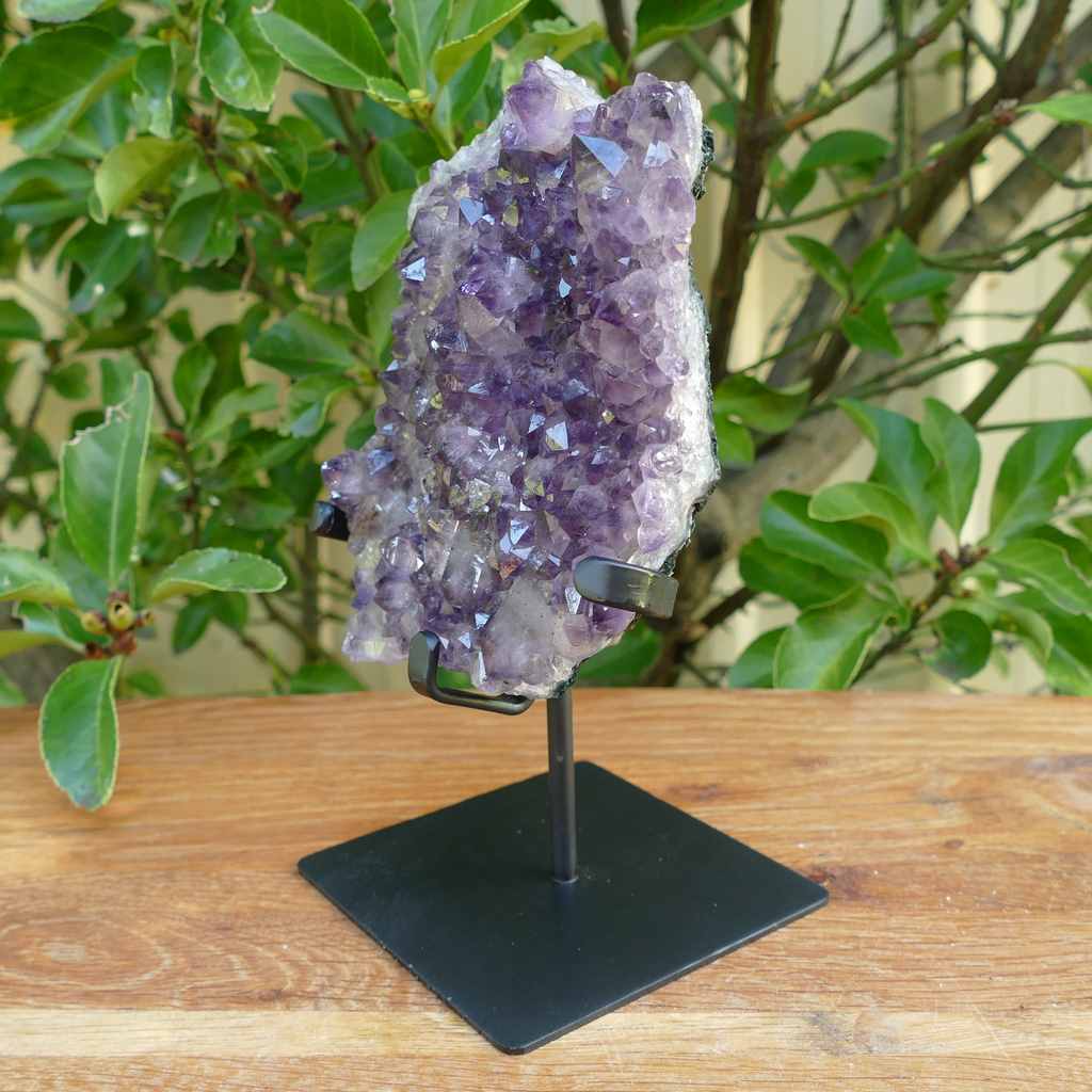 amethyst cluster on metal stand