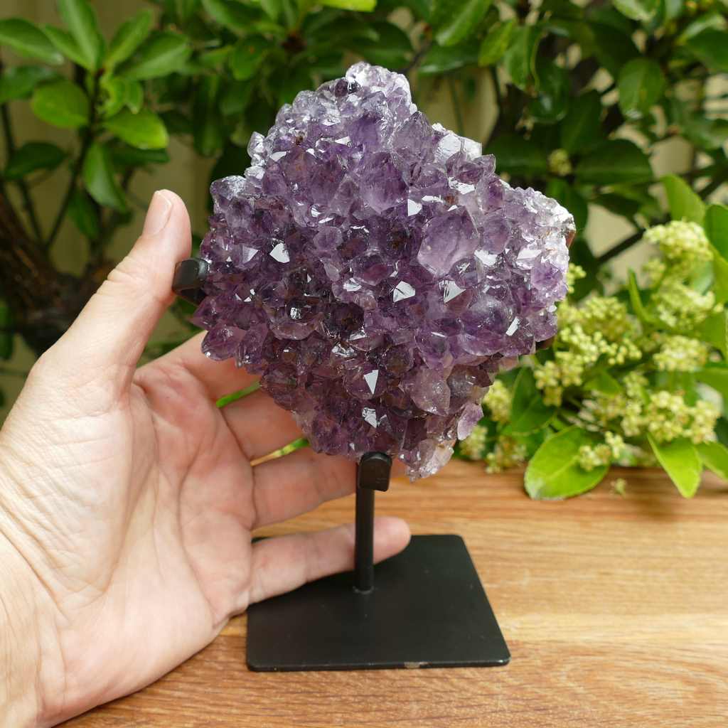 amethyst cluster on metal stand