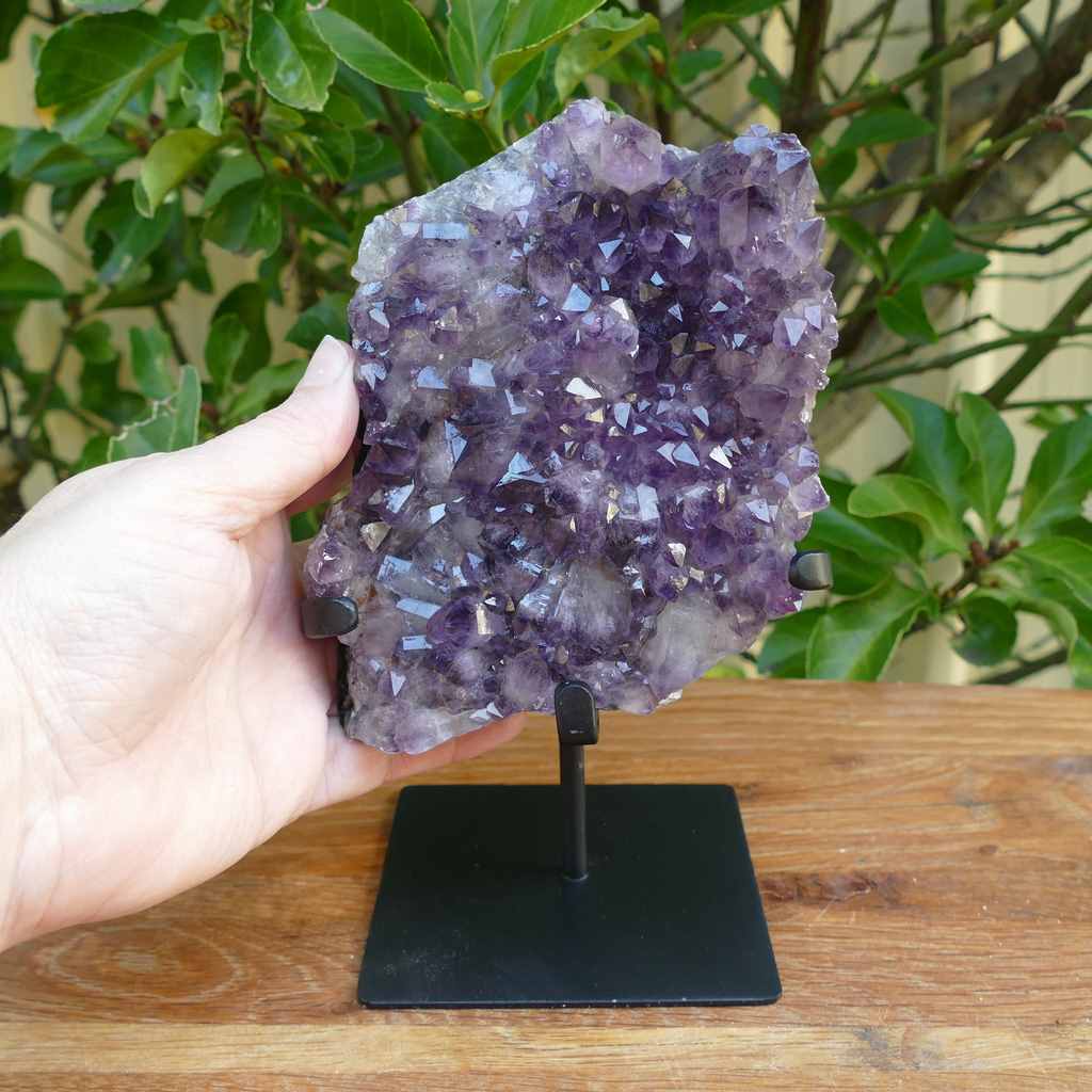 amethyst cluster on metal stand