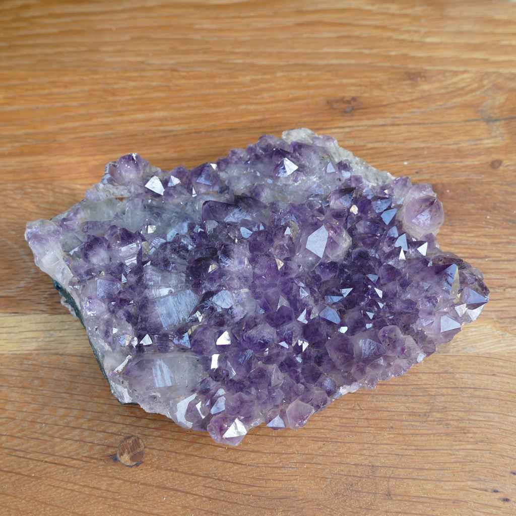 amethyst cluster on metal stand