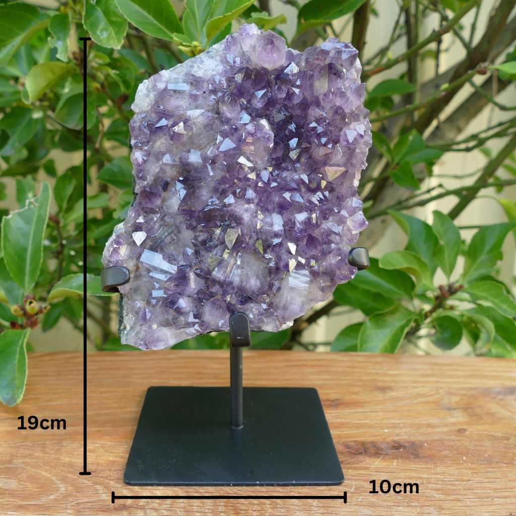 amethyst cluster on metal stand