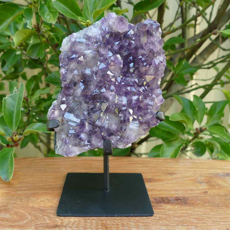 amethyst cluster on metal stand