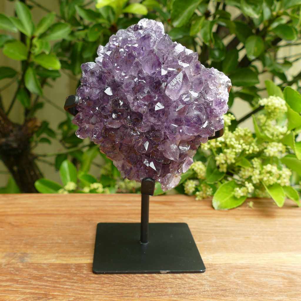 amethyst cluster on metal stand