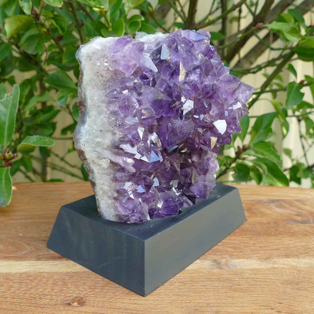 amethyst cluster on wood base