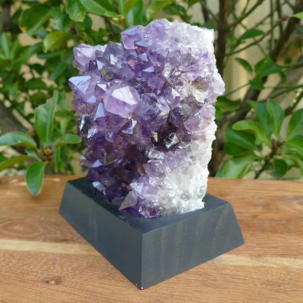 amethyst cluster on wood base