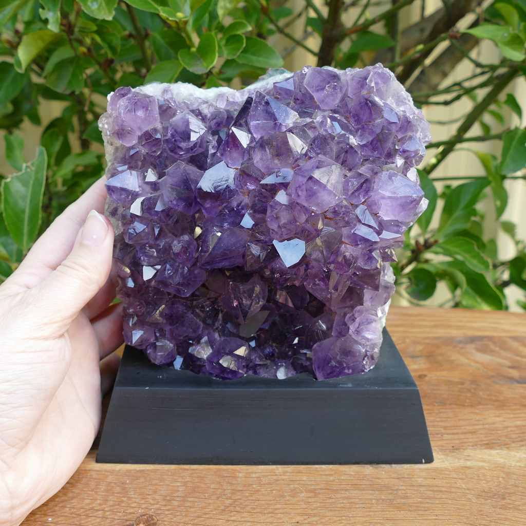 amethyst cluster on wood base