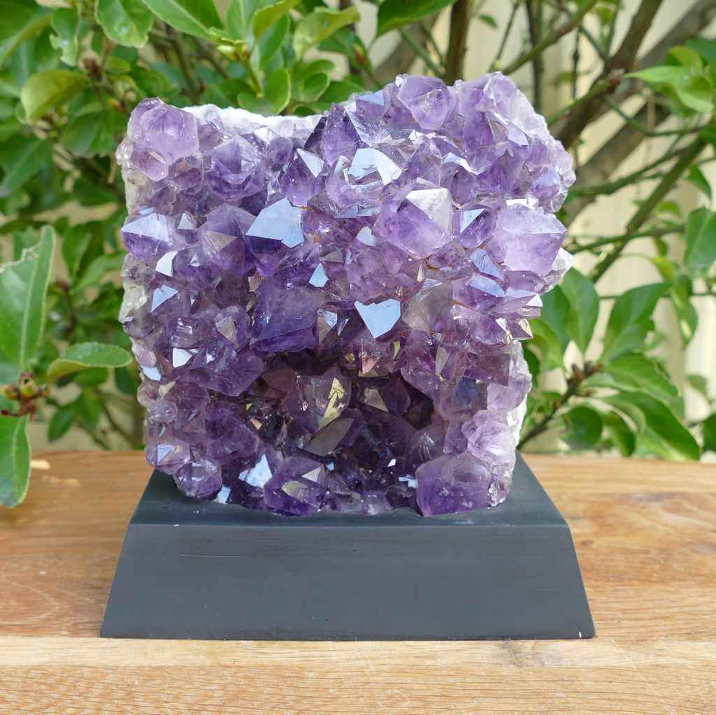 amethyst cluster on wood base