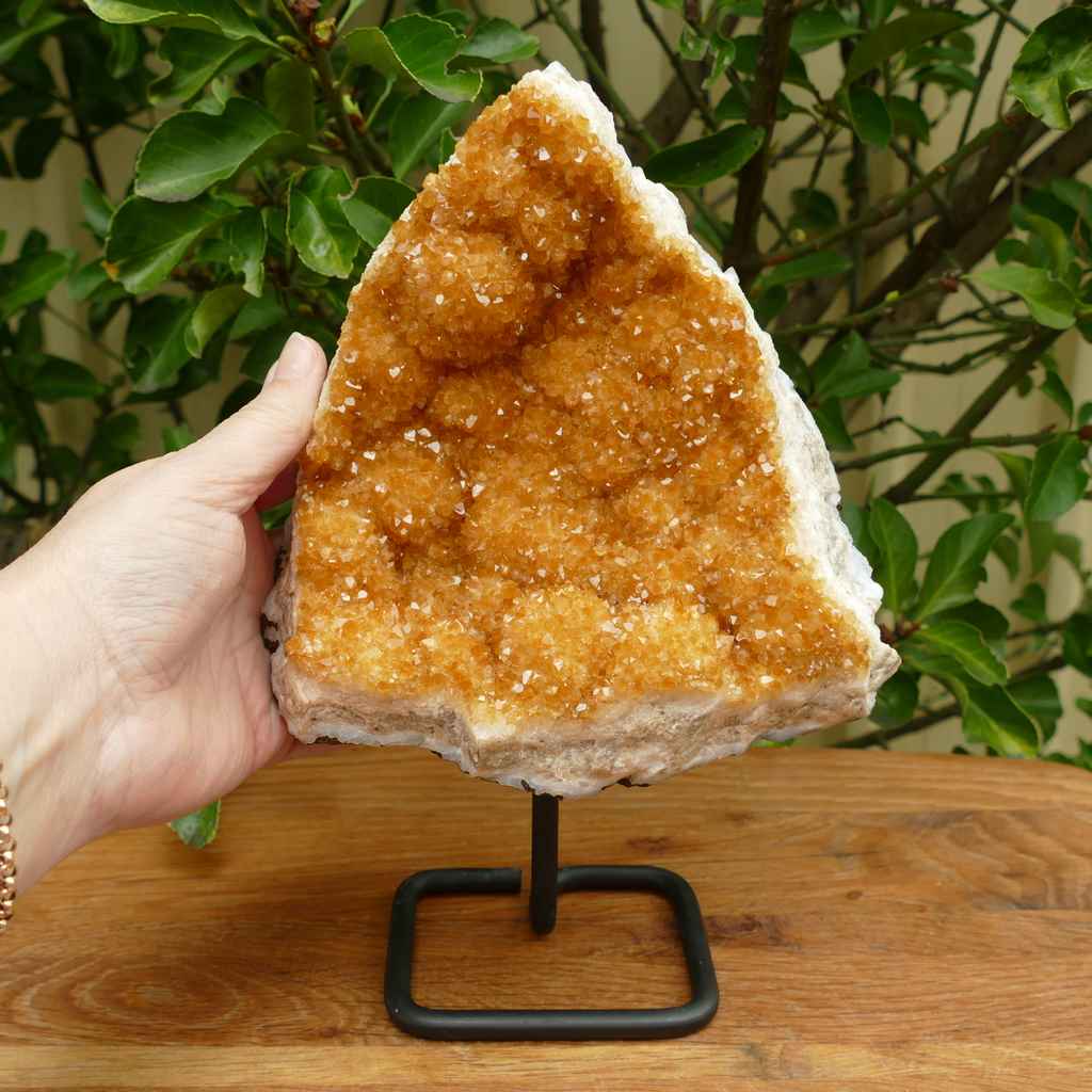 citrine cluster in metal stand