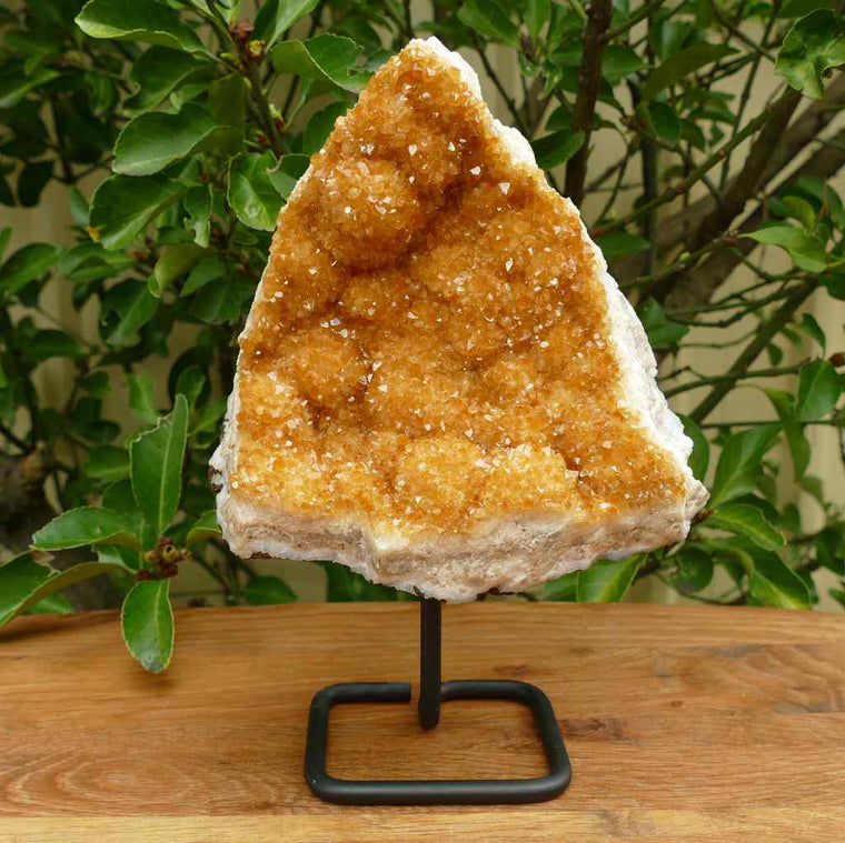 citrine cluster in metal stand