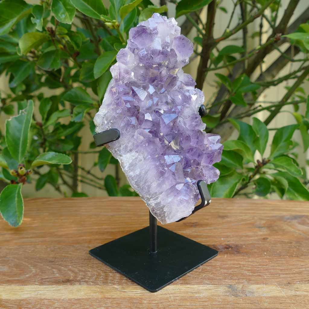 amethyst cluster on metal stand