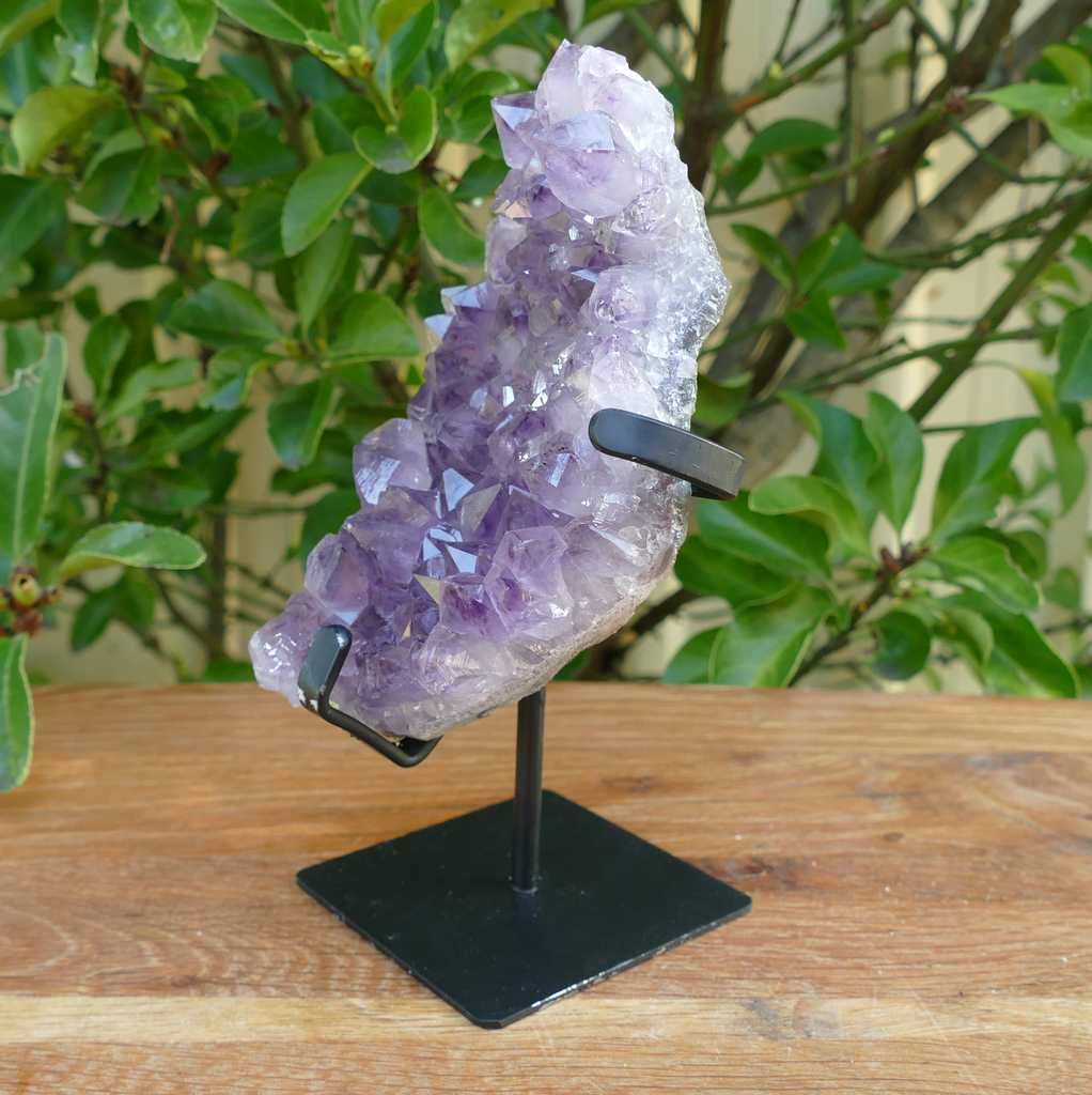 amethyst cluster on metal stand