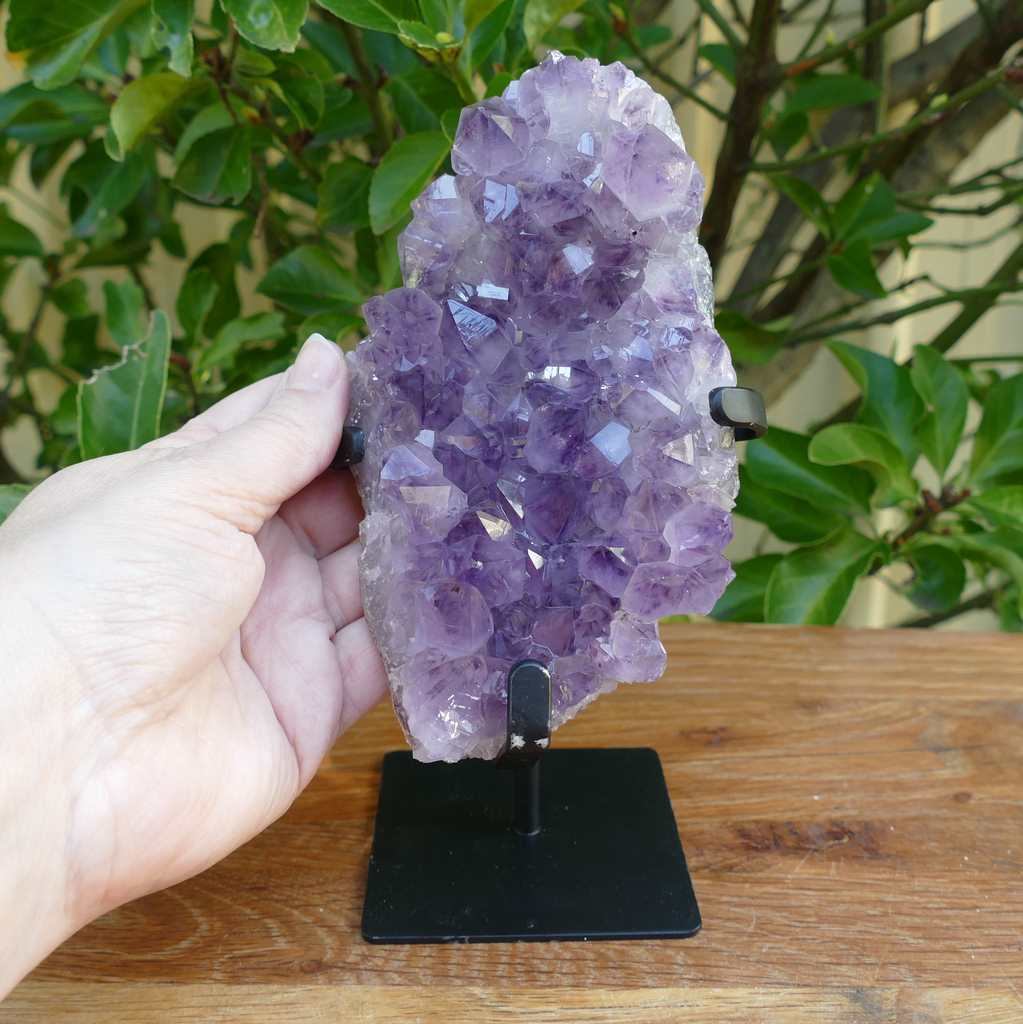 amethyst cluster on metal stand