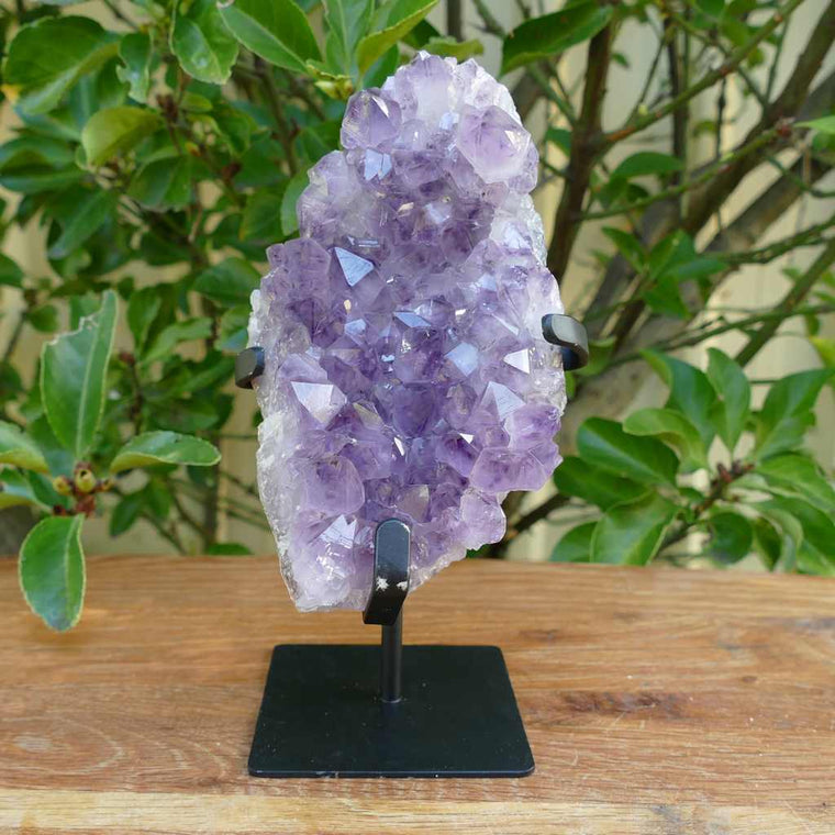 amethyst cluster on metal stand