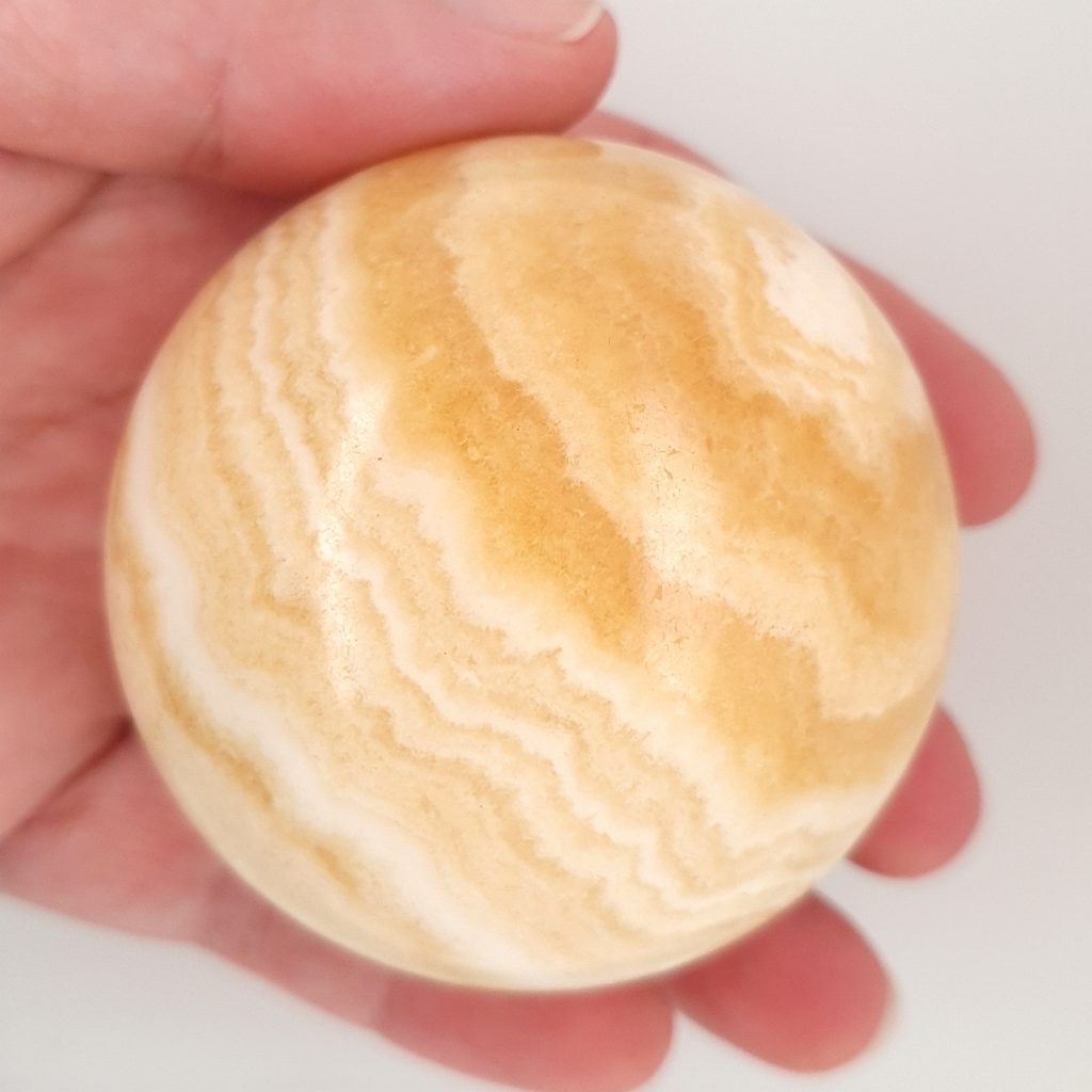 orange banded calcite crystal sphere