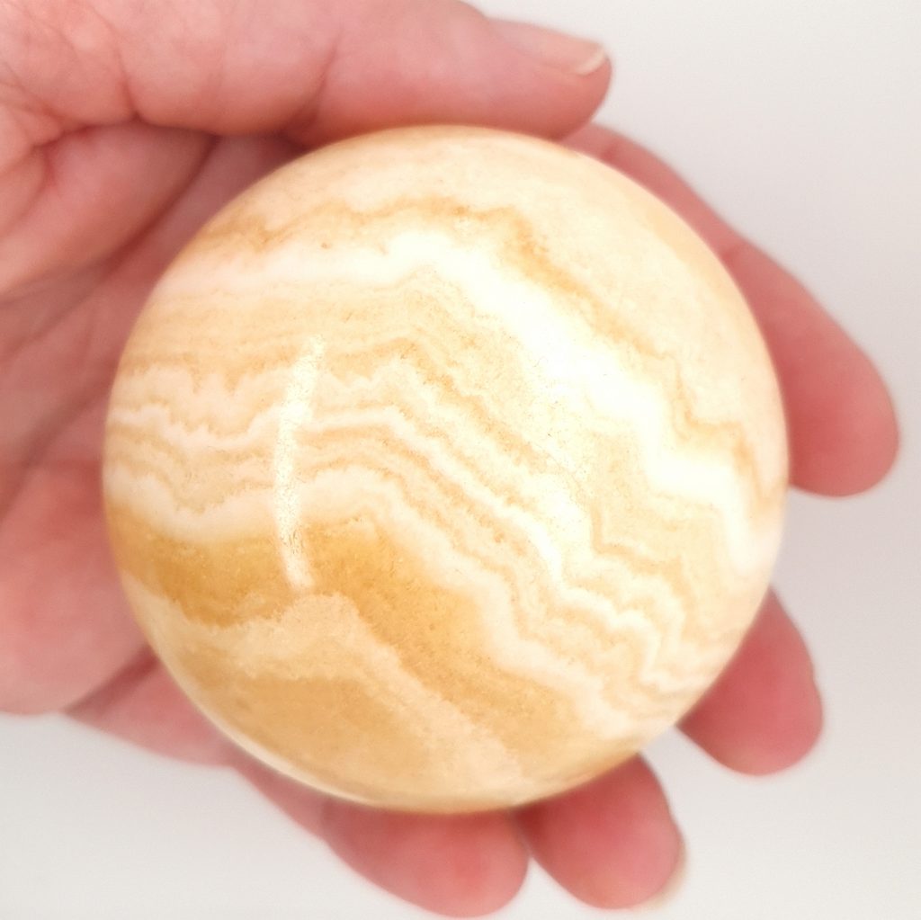 orange banded calcite crystal sphere
