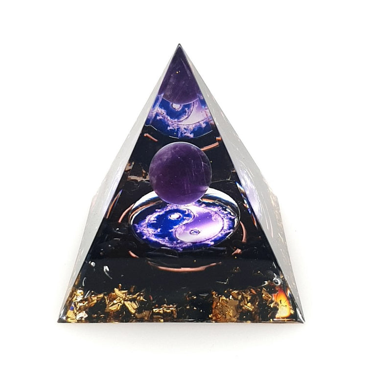 orgone pyramid with obsidian and an amethyst sphere