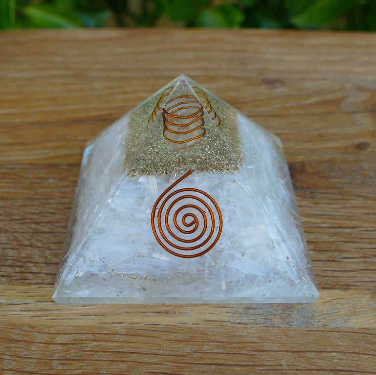 orgonite pyramid with selenite crystals